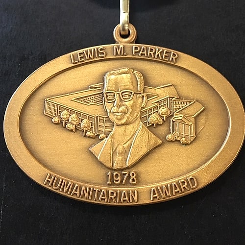 The Lewis M. Parker Humanitarian Award medal, showing a relief portrait of Lewis M. Parker with the Masonic Home behind him and the date 1978.